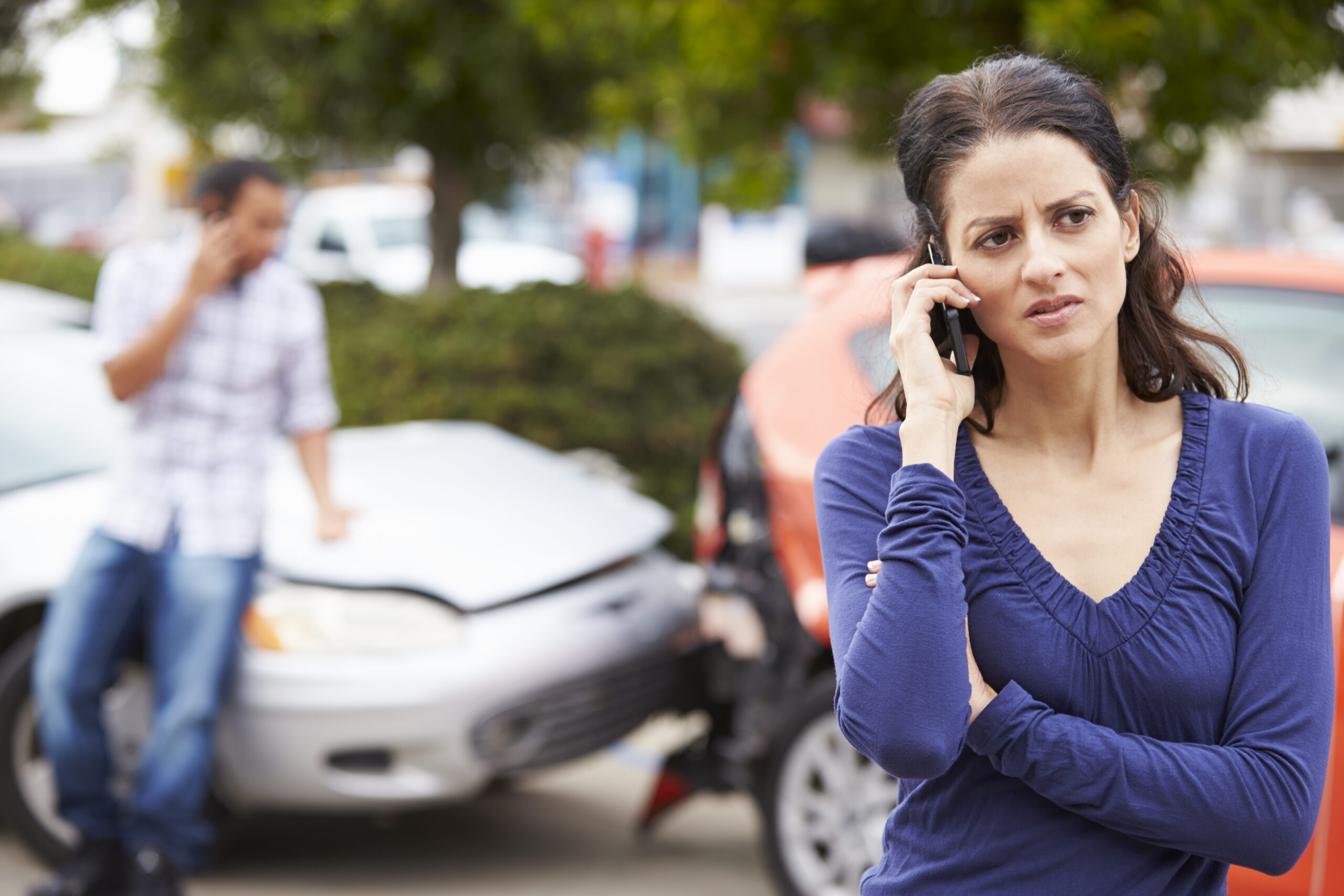 Picture of person on phone after a car crash